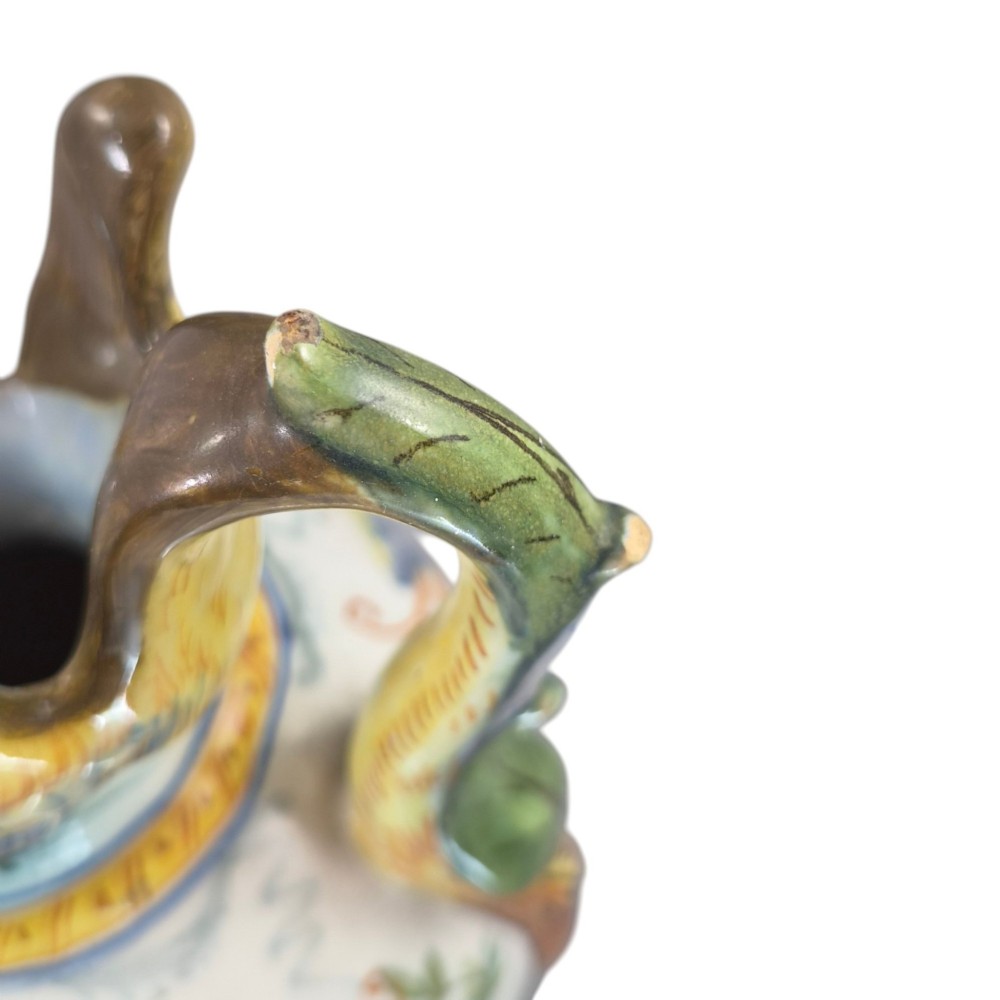 A pair of late 19th-century Italian Cantagalli tin-glazed majolica ceramic vessels, comprising a ruffled-rim vase and a sculpted ewer decorated with painted Renaissance grotesque motifs. View VII