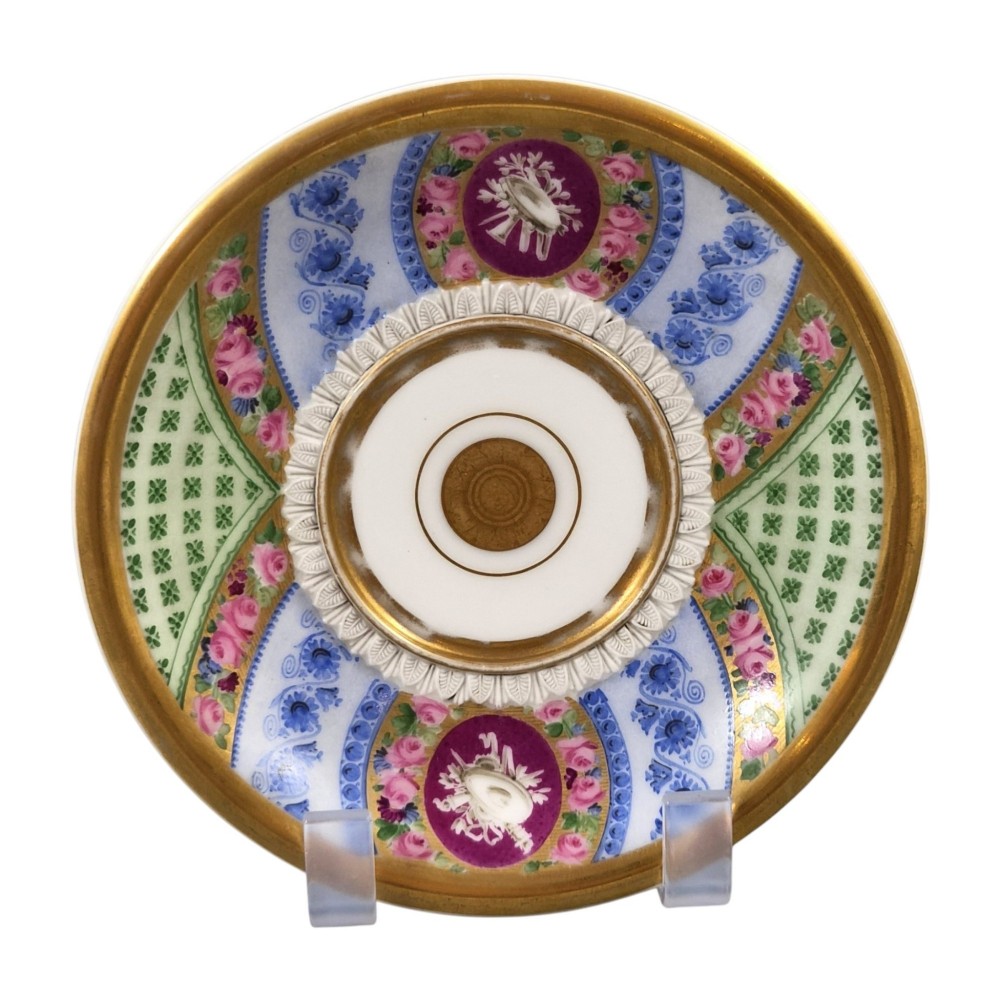A nineteenth-century French Vieux Paris porcelain cabinet cup and matching saucer featuring gold gilding, multi-coloured hand-painted panels, and a high-loop lion mask handle. View VII