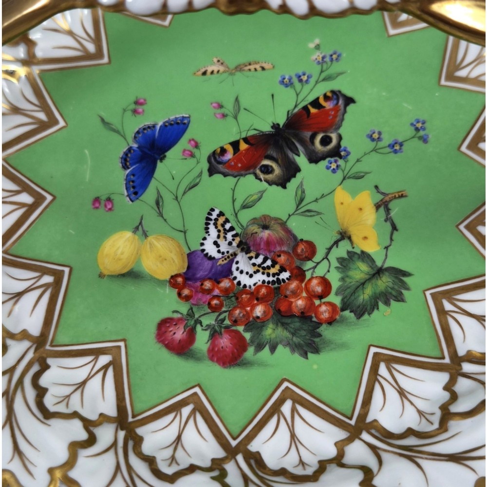 A Regency Flight, Barr and Barr Worcester porcelain handle basket featuring a bright green central reserve decorated with hand-painted butterflies and berries, surrounded by a leaf-moulded rim and gilt handle. View VIII