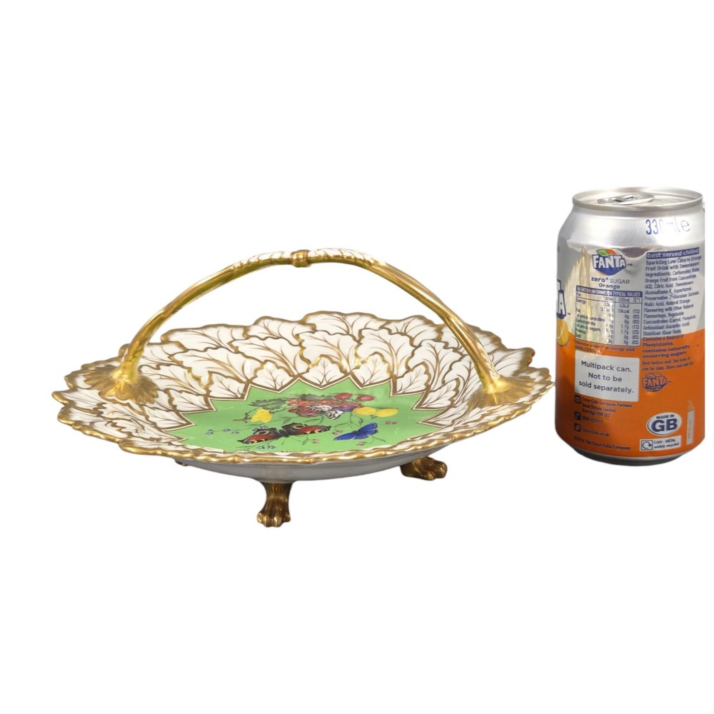 A Regency Flight, Barr and Barr Worcester porcelain handle basket featuring a bright green central reserve decorated with hand-painted butterflies and berries, surrounded by a leaf-moulded rim and gilt handle. View XIII