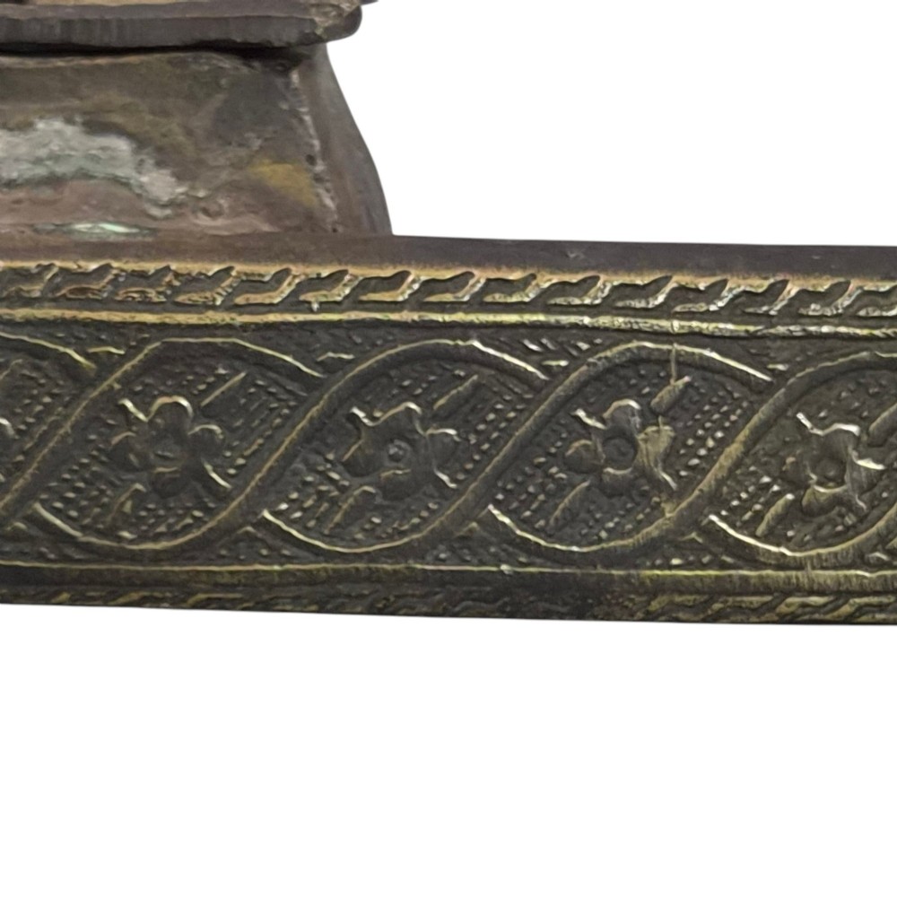 An antique cast and engraved brass travelling pen case and integrated inkwell featuring ornate scrollwork patterns and script. View VII