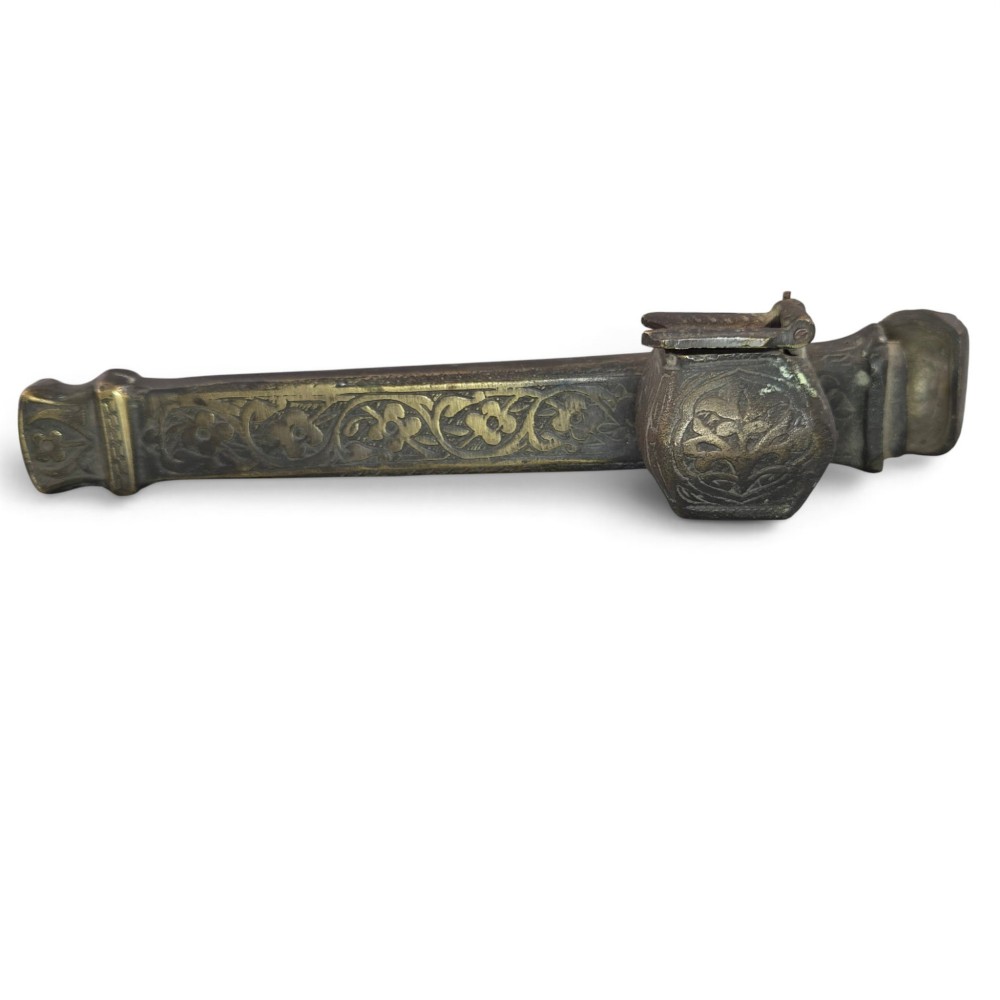 An antique cast and engraved brass travelling pen case and integrated inkwell featuring ornate scrollwork patterns and script. View IX
