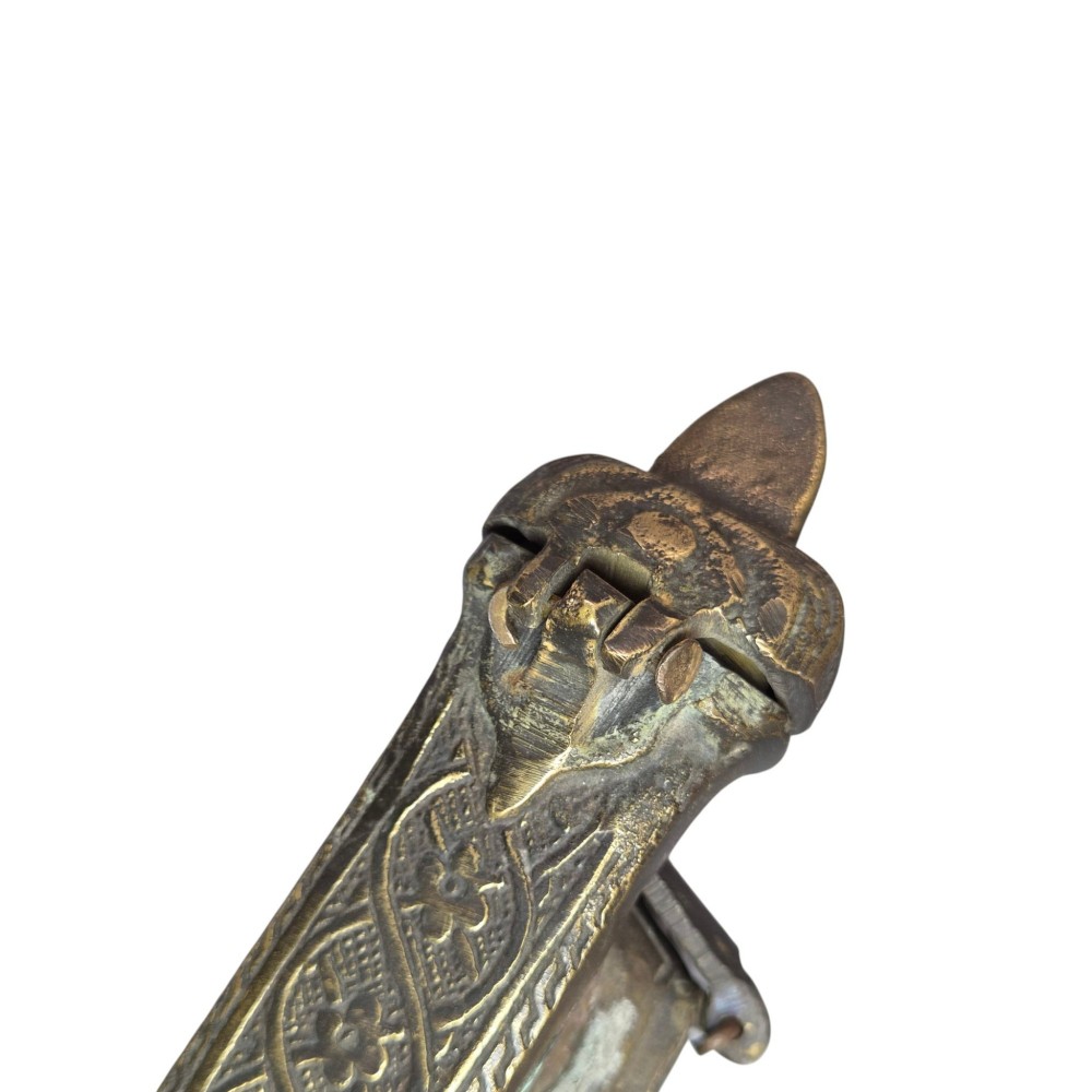 An antique cast and engraved brass travelling pen case and integrated inkwell featuring ornate scrollwork patterns and script. View XIV