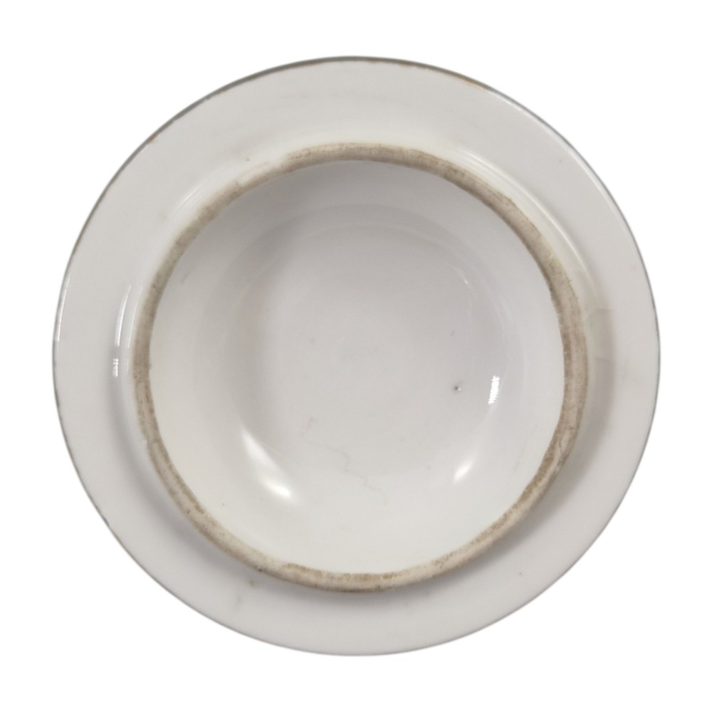 A white Sevres porcelain teapot featuring polychrome geometric enamel borders, gilt trim, a rounded body, and a gilded spherical lid finial. View X