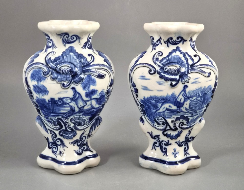 A fine and highly decorative pair of antique French faience vases made by Fourmaintraux-Courquin at Desvres, circa 1880.