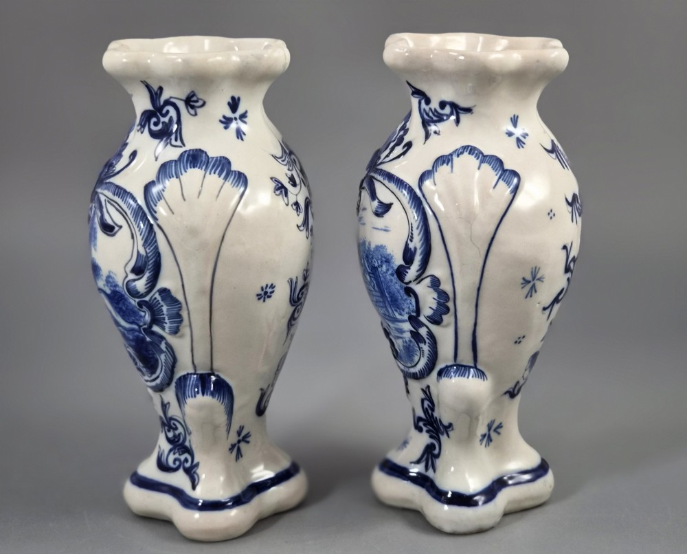 A pair of baluster-shaped blue and white hand-painted French faience vases featuring equestrian scenes and scrollwork motifs. View II