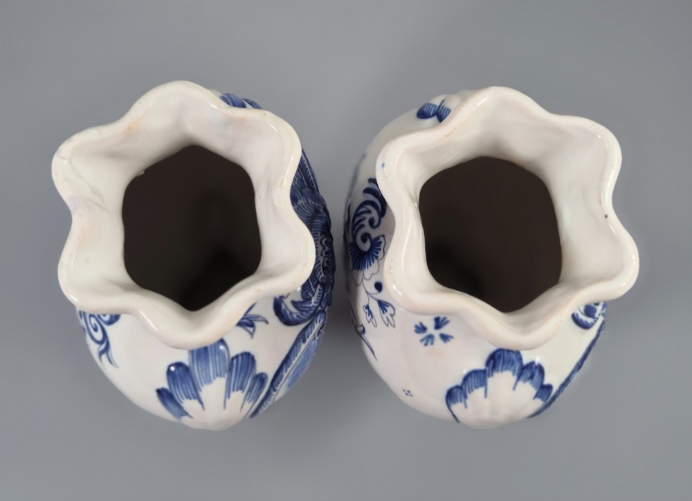 A pair of baluster-shaped blue and white hand-painted French faience vases featuring equestrian scenes and scrollwork motifs. View V
