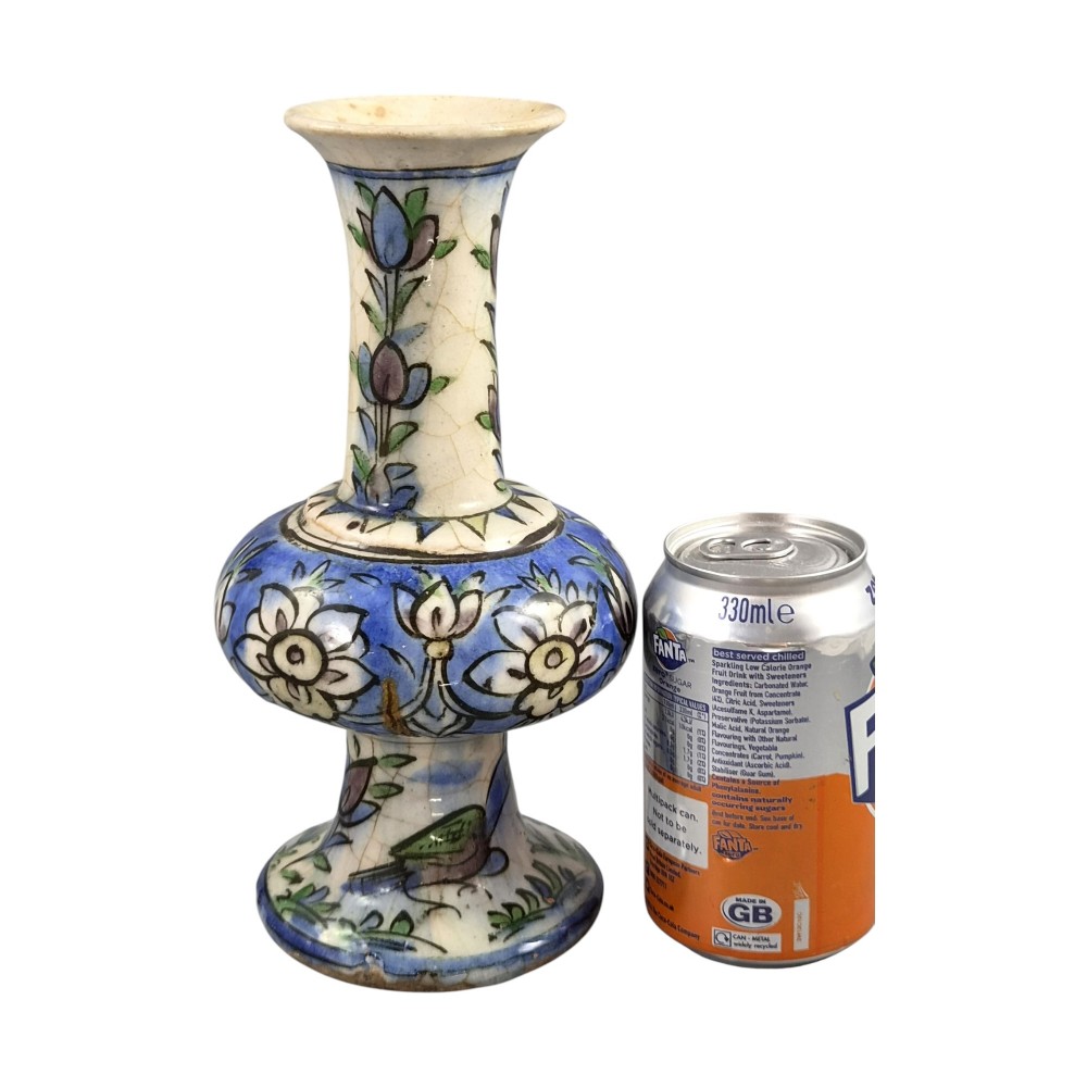 A late Qajar Persian polychrome ceramic vase featuring a central bulbous knop, flared rim, crackle glaze finish, and painted blue and green floral motifs. View VII