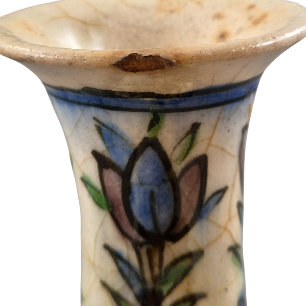 A late Qajar Persian polychrome ceramic vase featuring a central bulbous knop, flared rim, crackle glaze finish, and painted blue and green floral motifs. View VIII