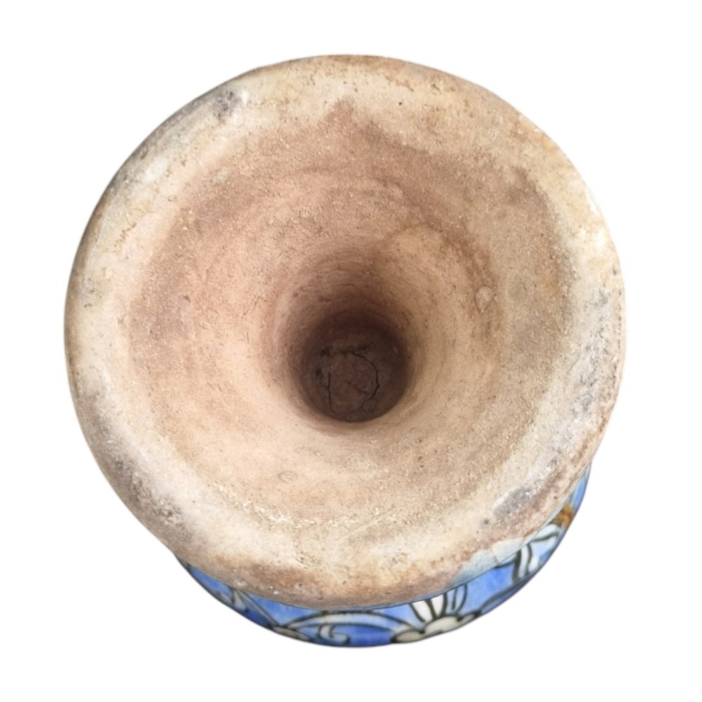 A late Qajar Persian polychrome ceramic vase featuring a central bulbous knop, flared rim, crackle glaze finish, and painted blue and green floral motifs. View XII