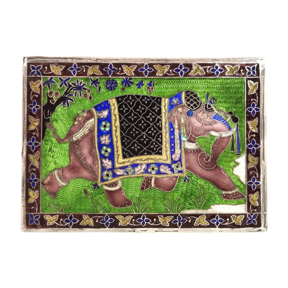 A rectangular sterling silver box featuring a colourful enamelled scene of a decorated Indian elephant set against a green background with a patterned border. View VII