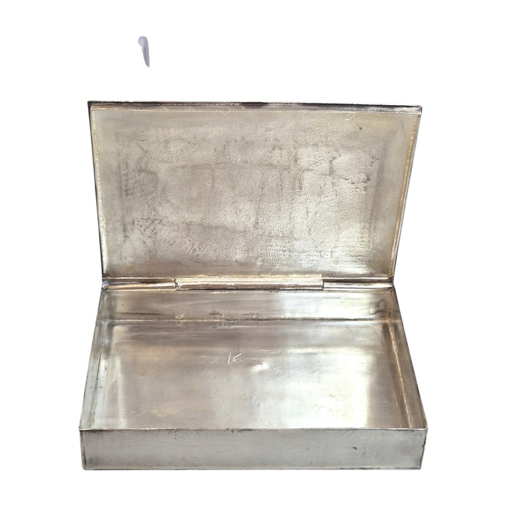 A rectangular sterling silver box featuring a colourful enamelled scene of a decorated Indian elephant set against a green background with a patterned border. View IX