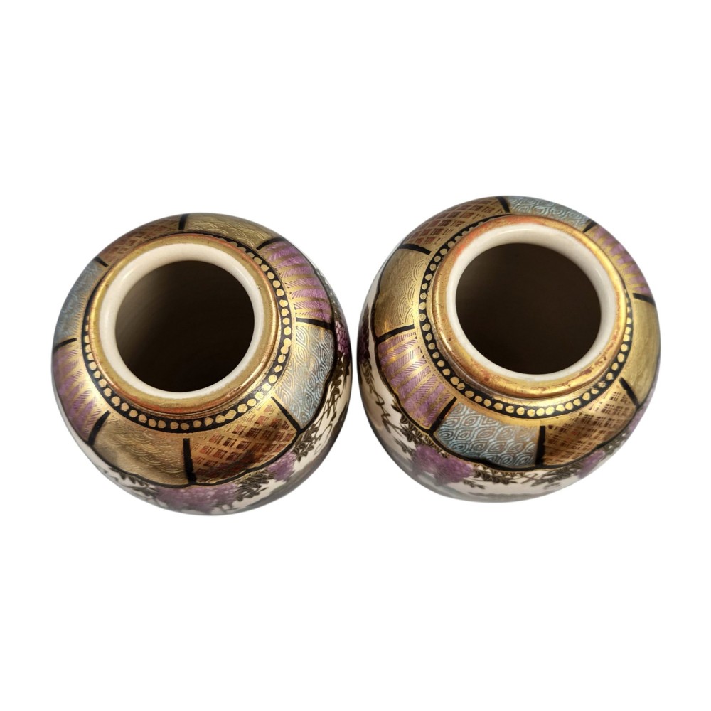 A pair of baluster-shaped Japanese Satsuma earthenware vases decorated with figures of women and children, wisteria flowers, and gold embellishments against a cream crackle glaze background. View V