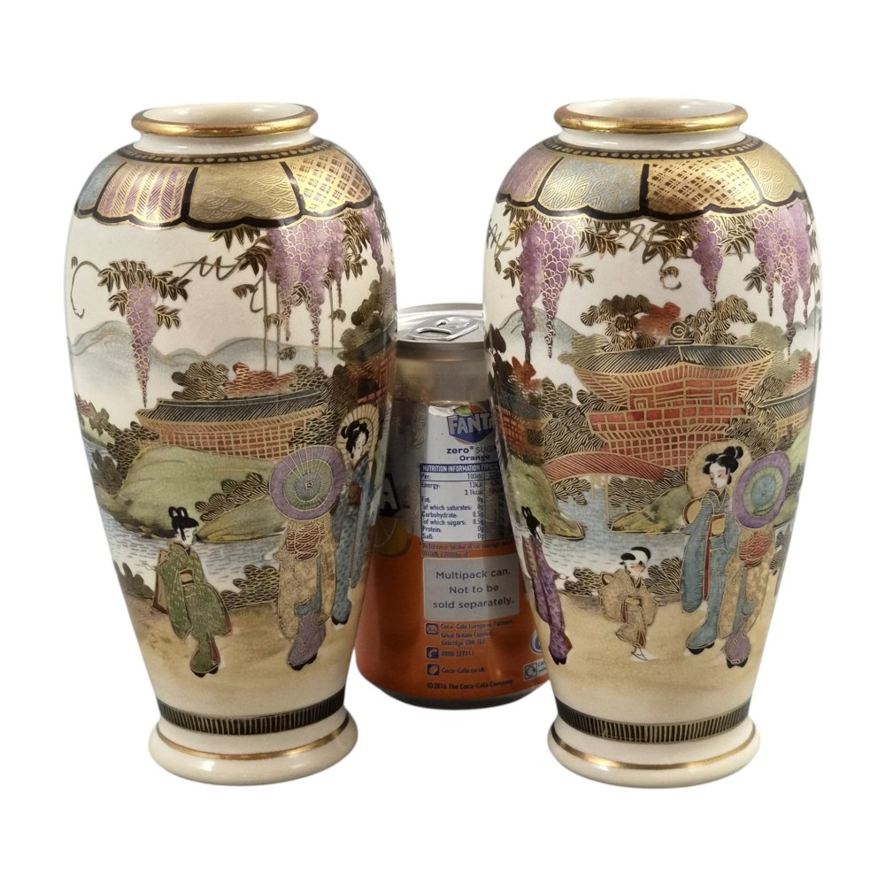 A pair of baluster-shaped Japanese Satsuma earthenware vases decorated with figures of women and children, wisteria flowers, and gold embellishments against a cream crackle glaze background. View XI