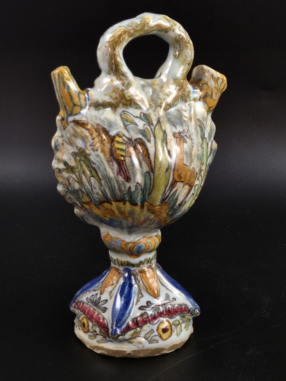 An 18th-century Italian majolica pilgrim flask featuring a scallop-shell body, twin spouts, loop handles, a pedestal foot, and hand-painted polychrome flora and fauna. View III