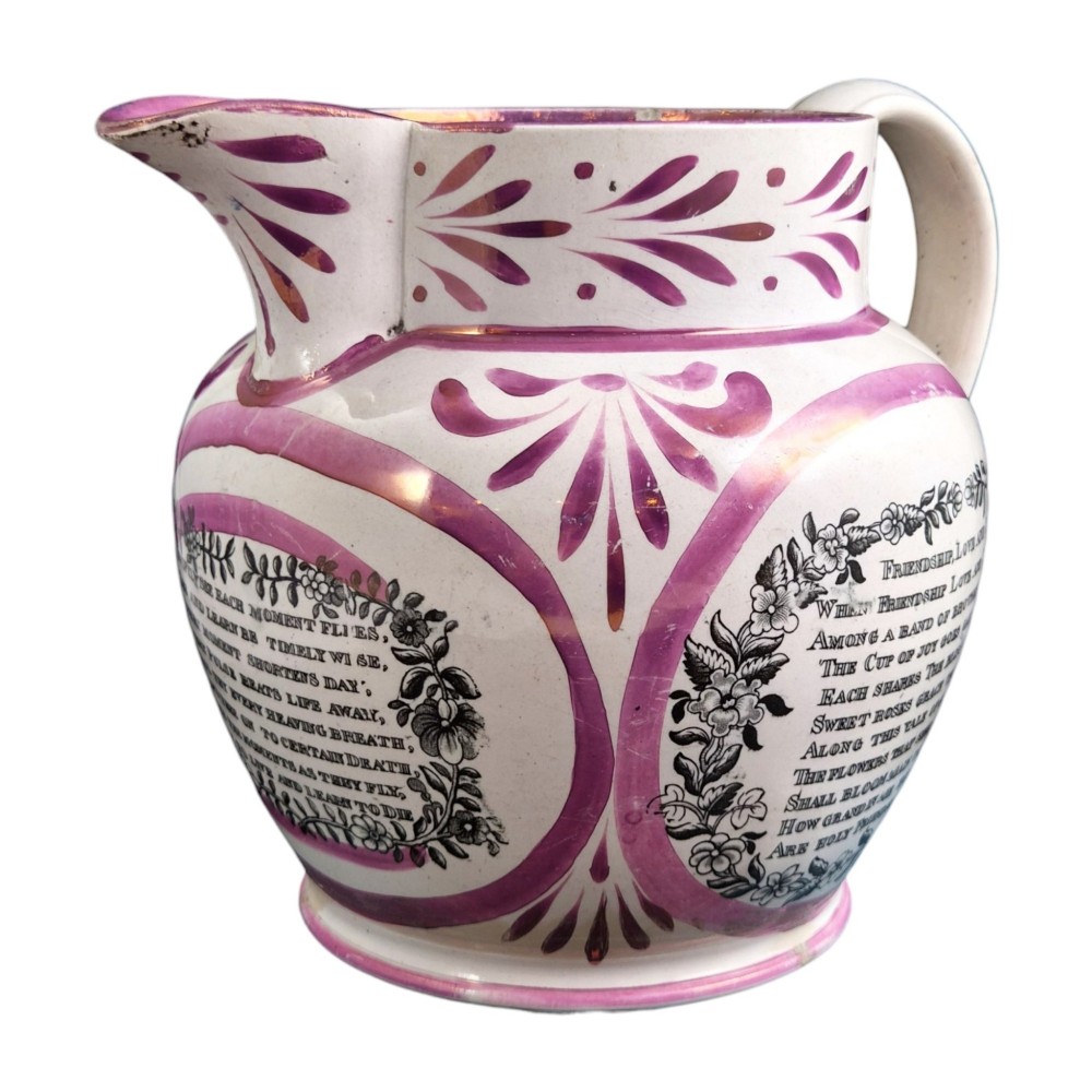 An antique white earthenware jug decorated with pink metallic lustre foliage borders and a black transfer-printed Masonic emblem featuring twin columns and symbolic motifs. View IV
