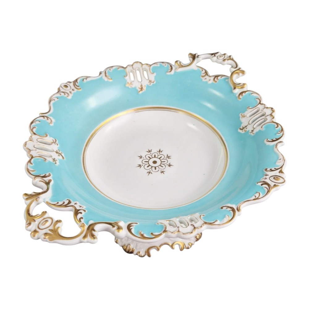 A Victorian Coalport bone china tazza featuring a turquoise border, central floral motif, gilded scroll accents, and a footed stem base. View III