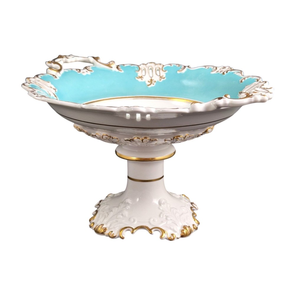 A Victorian Coalport bone china tazza featuring a turquoise border, central floral motif, gilded scroll accents, and a footed stem base. View V