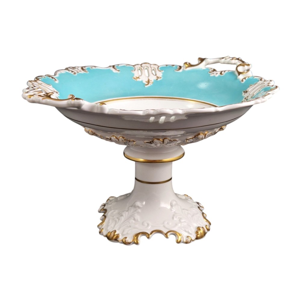 A Victorian Coalport bone china tazza featuring a turquoise border, central floral motif, gilded scroll accents, and a footed stem base. View VI