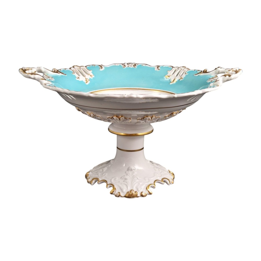 A Victorian Coalport bone china tazza featuring a turquoise border, central floral motif, gilded scroll accents, and a footed stem base. View VII