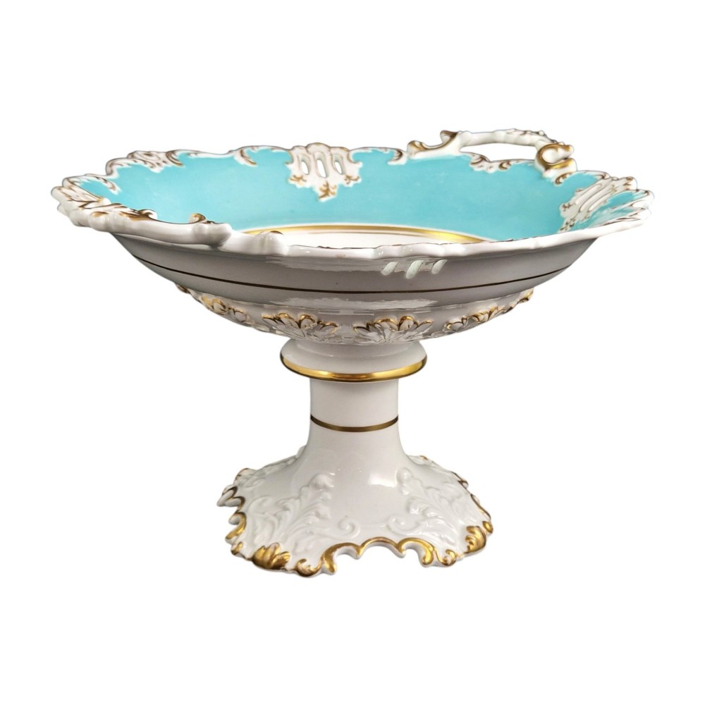A Victorian Coalport bone china tazza featuring a turquoise border, central floral motif, gilded scroll accents, and a footed stem base. View IX
