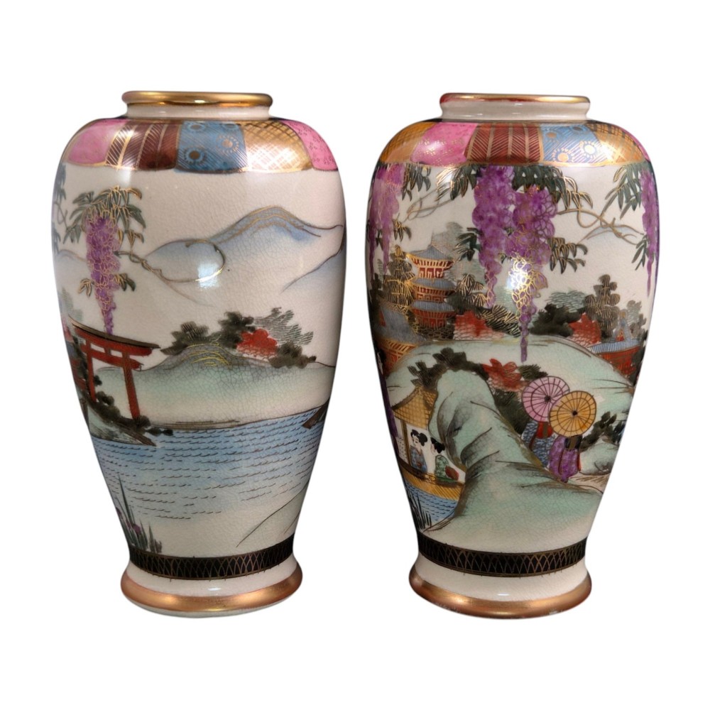 A pair of cream ceramic Satsuma vases decorated with hand-painted scenes of purple wisteria, figures in boats, and pagodas with gilded highlights. View V