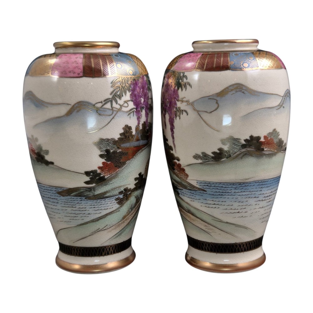 A pair of cream ceramic Satsuma vases decorated with hand-painted scenes of purple wisteria, figures in boats, and pagodas with gilded highlights. View VII