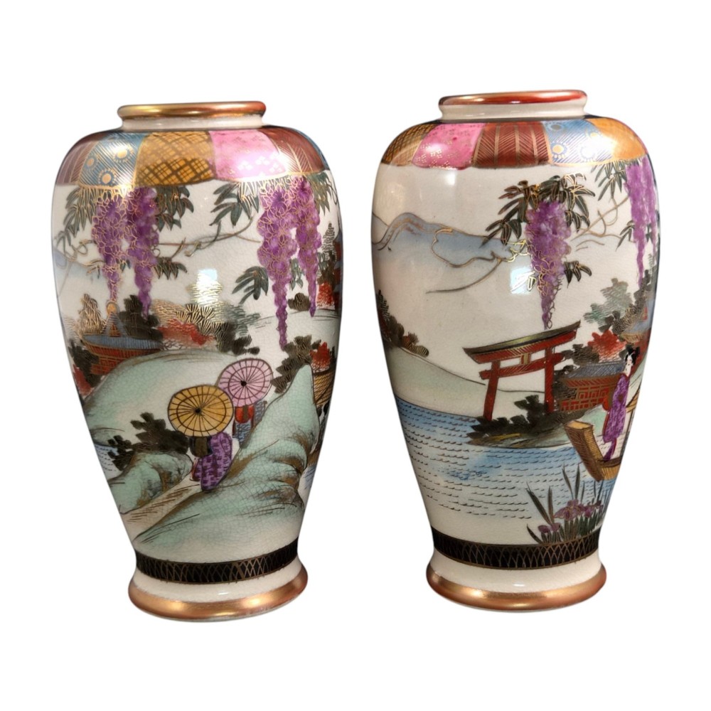 A pair of cream ceramic Satsuma vases decorated with hand-painted scenes of purple wisteria, figures in boats, and pagodas with gilded highlights. View IX