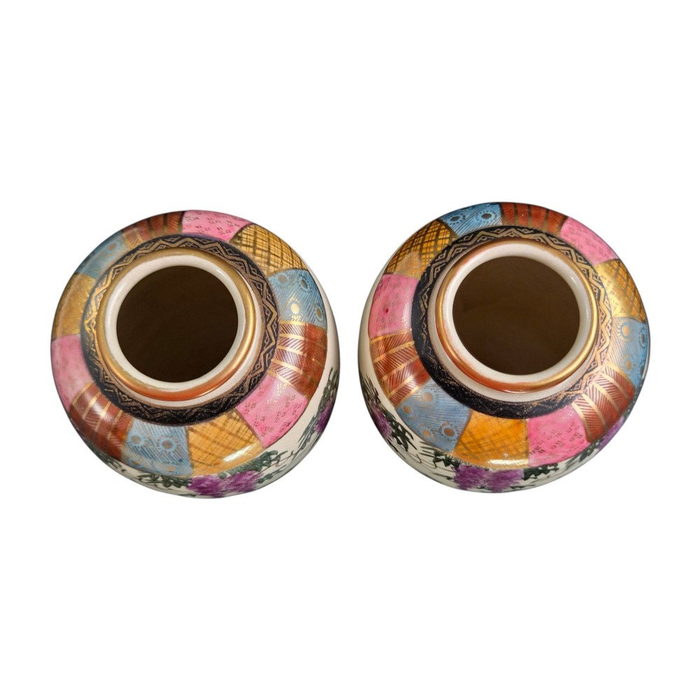 A pair of cream ceramic Satsuma vases decorated with hand-painted scenes of purple wisteria, figures in boats, and pagodas with gilded highlights. View X