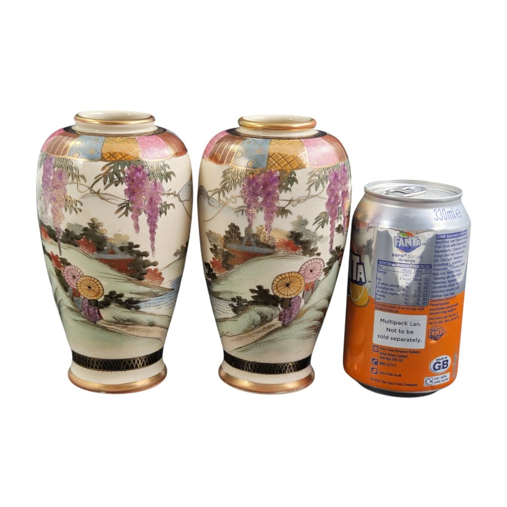A pair of cream ceramic Satsuma vases decorated with hand-painted scenes of purple wisteria, figures in boats, and pagodas with gilded highlights. View XV