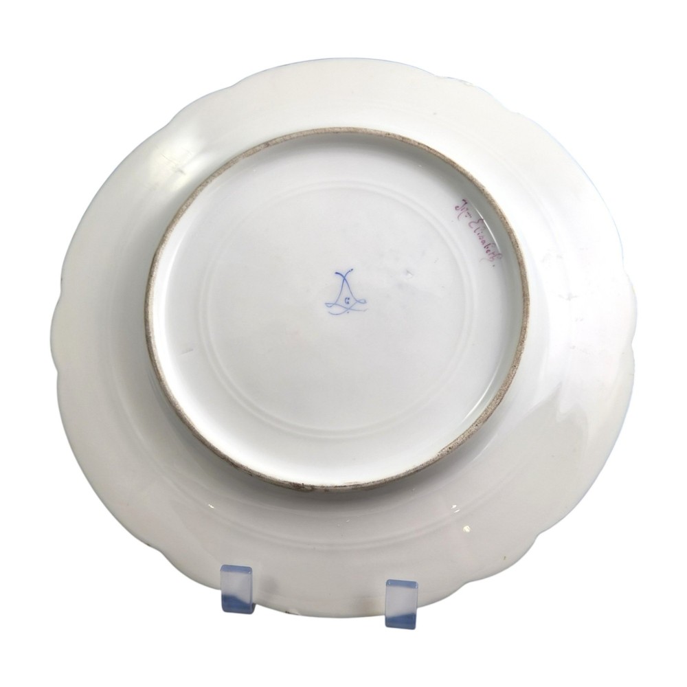 A circular porcelain cabinet plate featuring a central hand-painted portrait of a woman framed by a deep cobalt blue rim with gold scrollwork. View IV