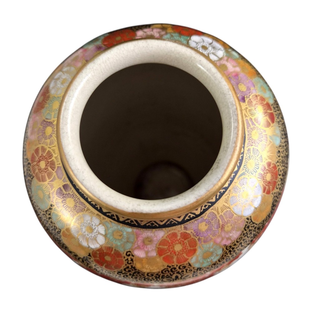 A pair of Japanese Satsuma earthenware vases decorated with intricate hand-painted floral motifs, autumn maple leaves, chrysanthemums, and gold accents over a crackle glaze. View IX