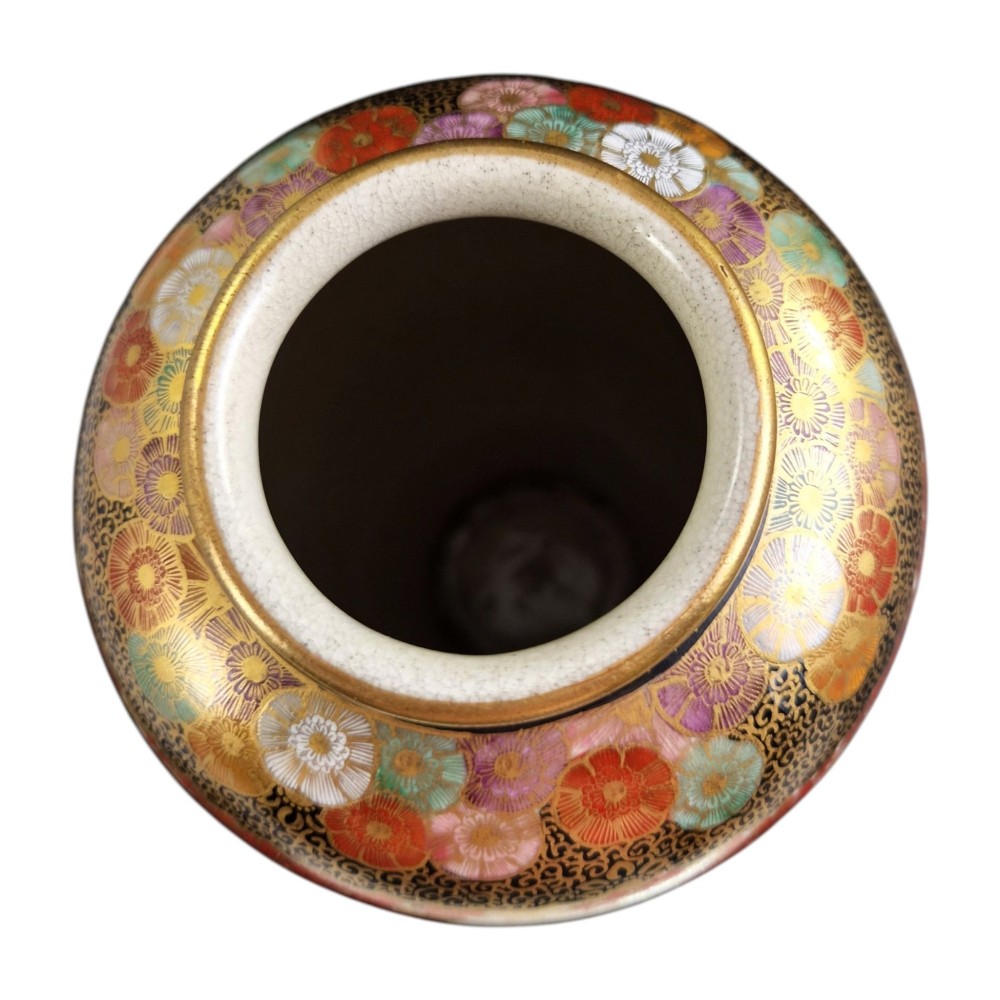 A pair of Japanese Satsuma earthenware vases decorated with intricate hand-painted floral motifs, autumn maple leaves, chrysanthemums, and gold accents over a crackle glaze. View XII