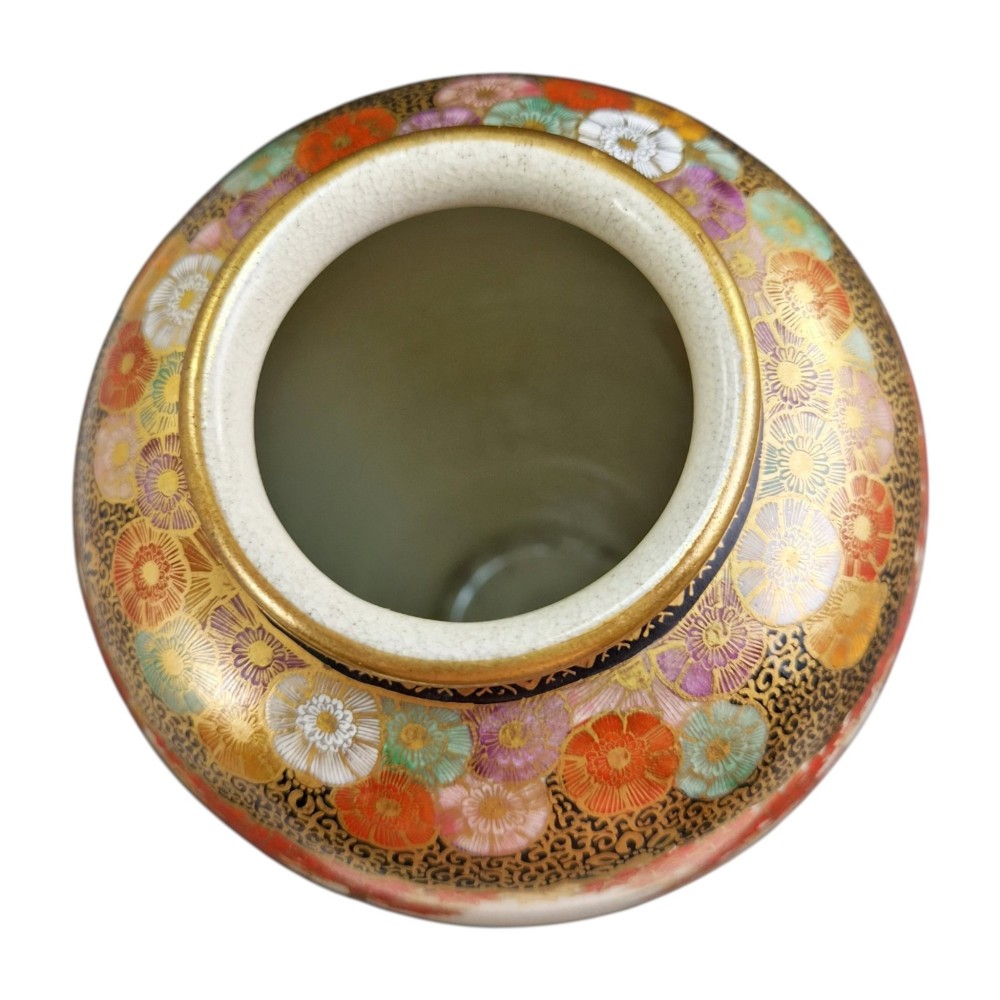 A pair of Japanese Satsuma earthenware vases decorated with intricate hand-painted floral motifs, autumn maple leaves, chrysanthemums, and gold accents over a crackle glaze. View XIII