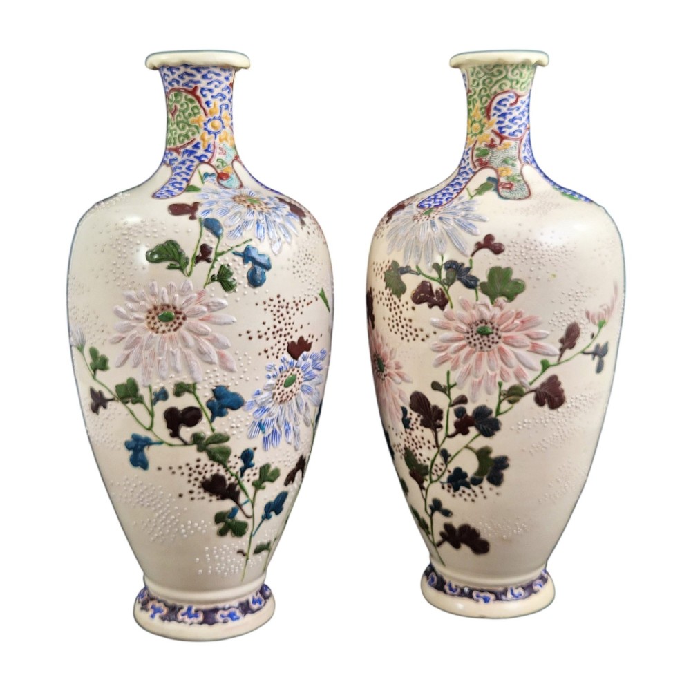 A pair of Japanese Satsuma earthenware vases decorated with raised moriage enamel chrysanthemums on a cream crackle background. View II