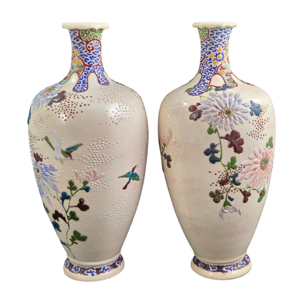 A pair of Japanese Satsuma earthenware vases decorated with raised moriage enamel chrysanthemums on a cream crackle background. View IV