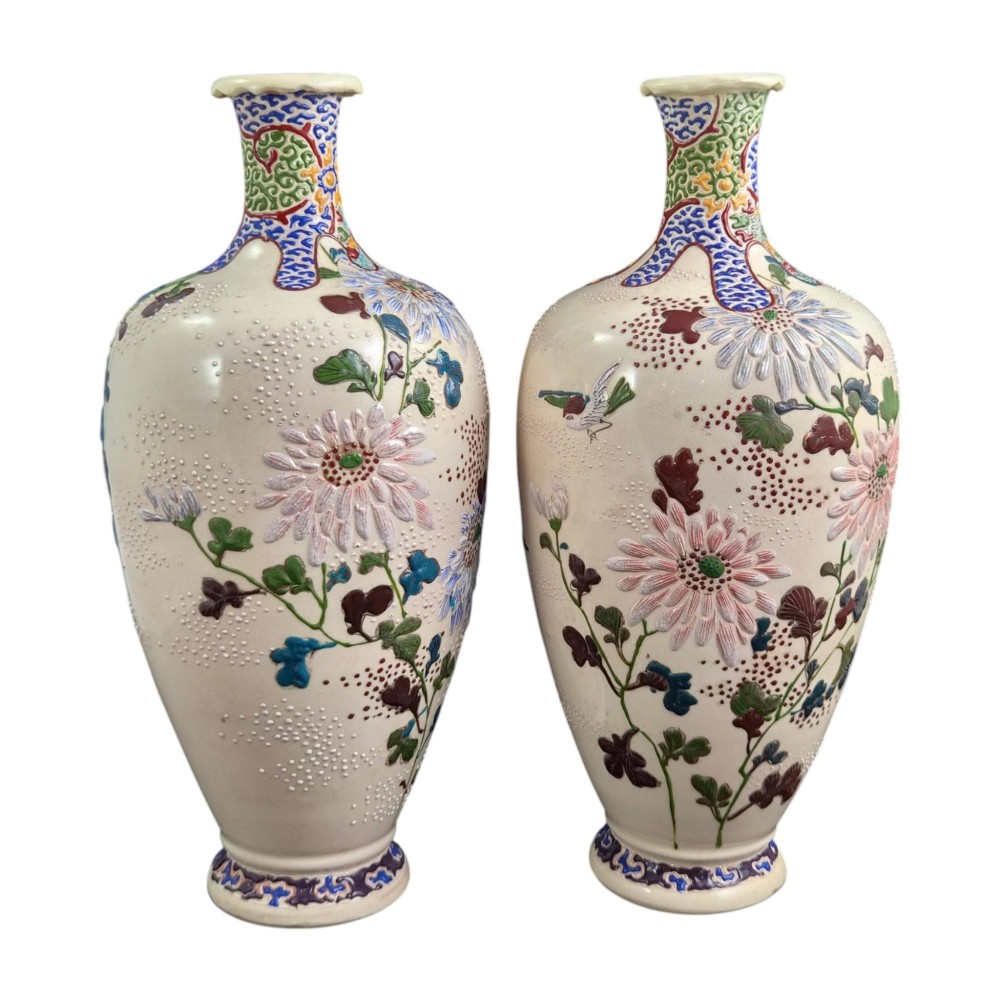 A pair of Japanese Satsuma earthenware vases decorated with raised moriage enamel chrysanthemums on a cream crackle background. View VIII