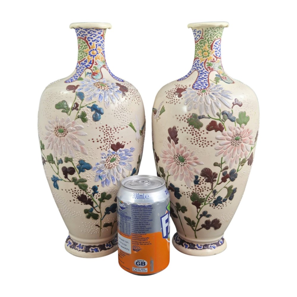 A pair of Japanese Satsuma earthenware vases decorated with raised moriage enamel chrysanthemums on a cream crackle background. View IX