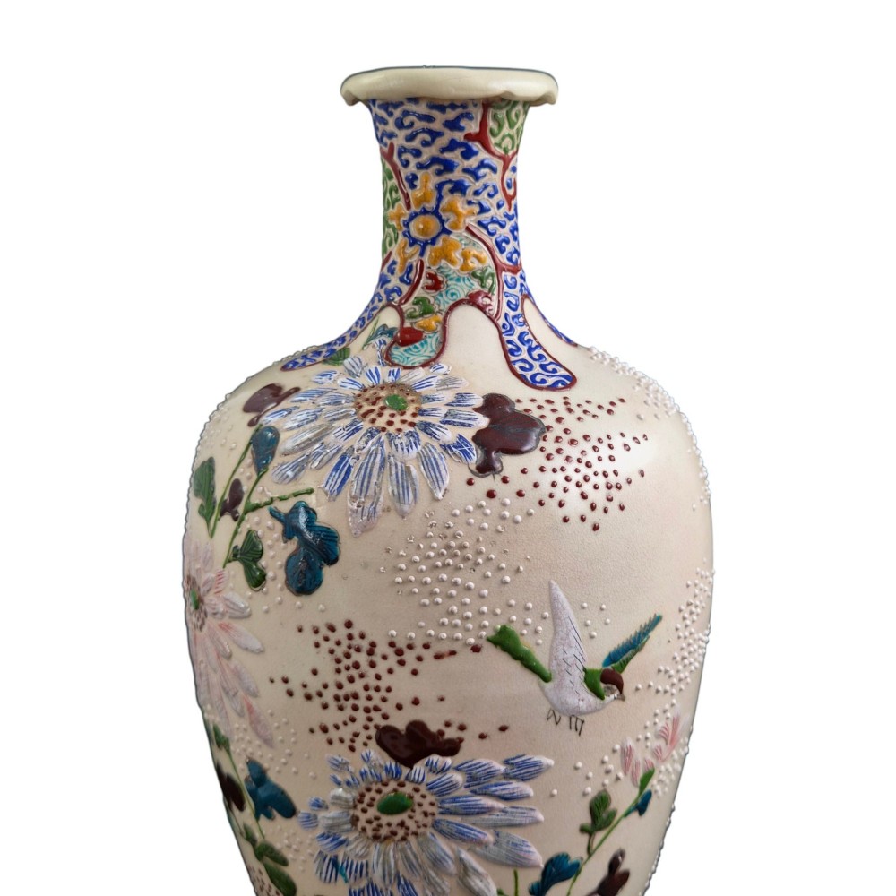 A pair of Japanese Satsuma earthenware vases decorated with raised moriage enamel chrysanthemums on a cream crackle background. View X
