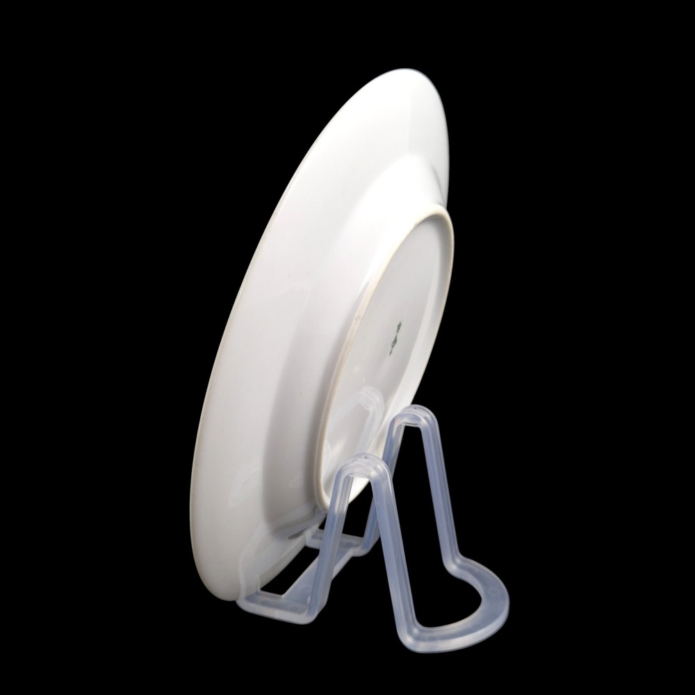 A circular white porcelain plate with twin gilded rim borders and a small Russian Imperial double-headed eagle crest near the top edge. View VII
