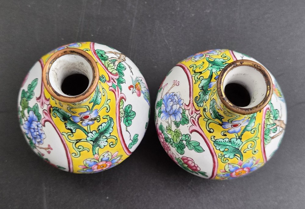 A pair of 19th-century Chinese Canton enamel miniature vases featuring hand-painted roosters and foliage framed within circular medallions against a bright yellow ground. View V