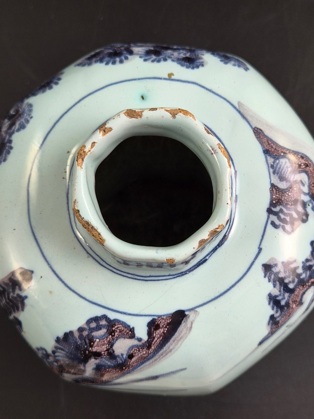 An octagonal antique Dutch Delft tin-glazed earthenware baluster vase painted in blue and manganese depicting a Chinese scholar. View VIII