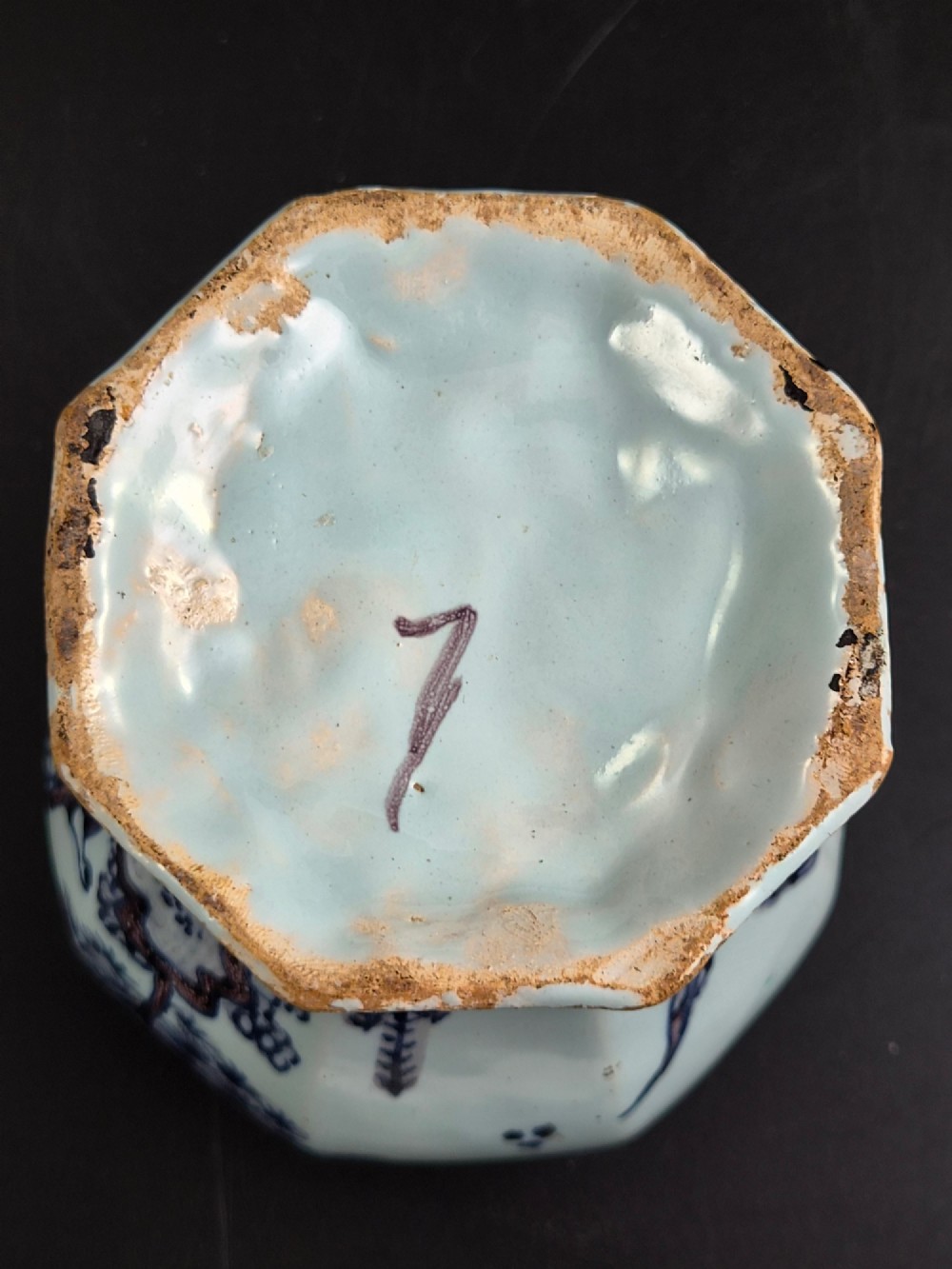 An octagonal antique Dutch Delft tin-glazed earthenware baluster vase painted in blue and manganese depicting a Chinese scholar. View IX