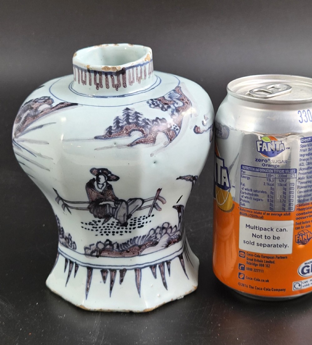 An octagonal antique Dutch Delft tin-glazed earthenware baluster vase painted in blue and manganese depicting a Chinese scholar. View X