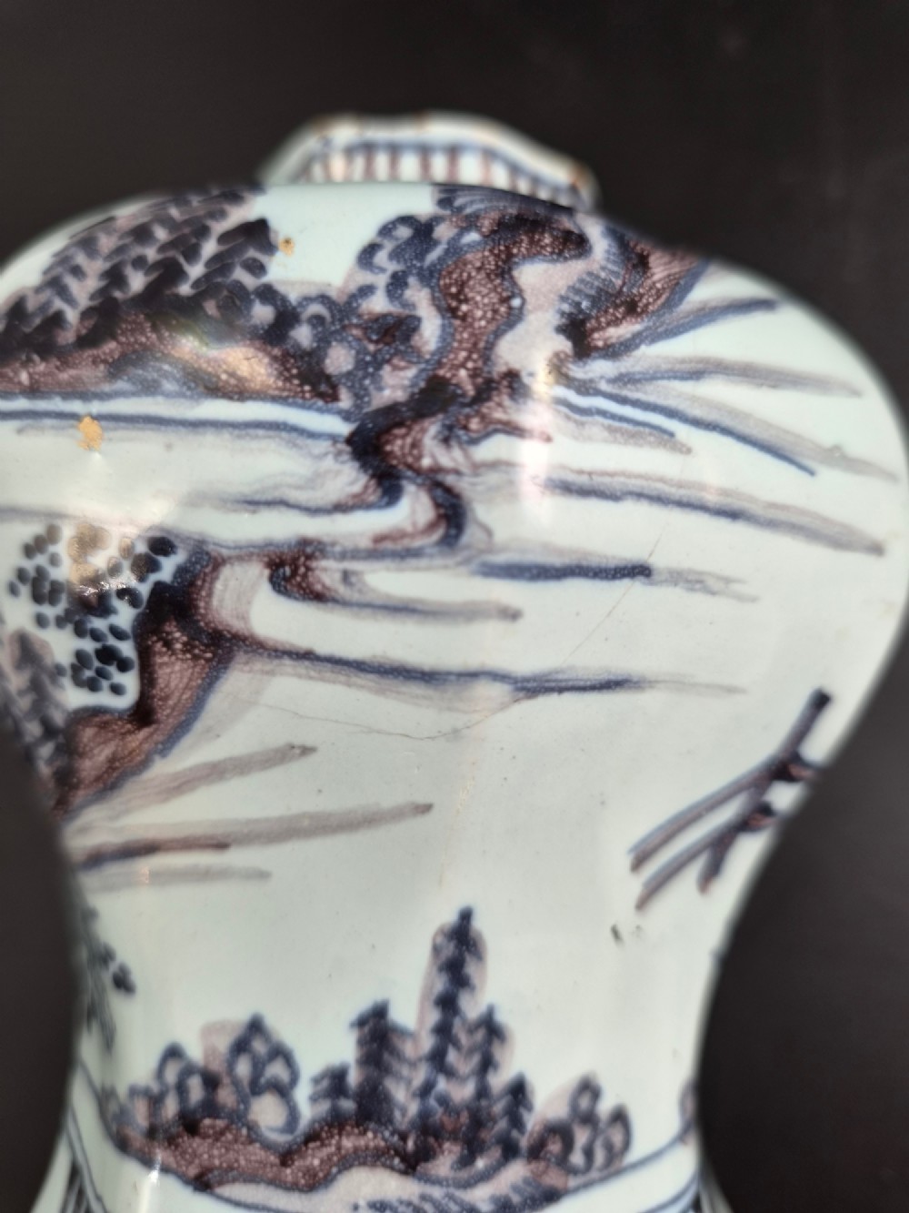 An octagonal antique Dutch Delft tin-glazed earthenware baluster vase painted in blue and manganese depicting a Chinese scholar. View XI