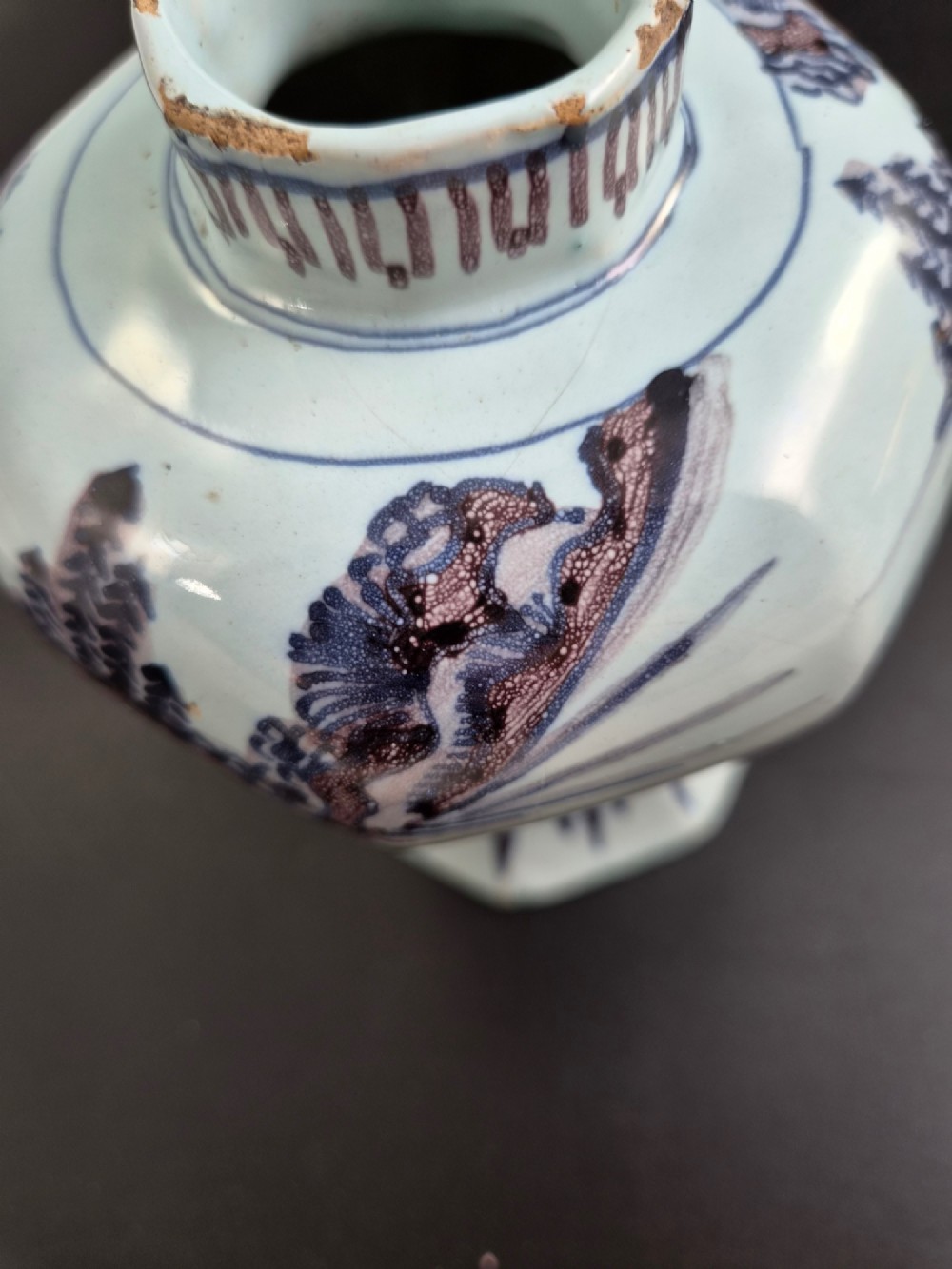 An octagonal antique Dutch Delft tin-glazed earthenware baluster vase painted in blue and manganese depicting a Chinese scholar. View XII