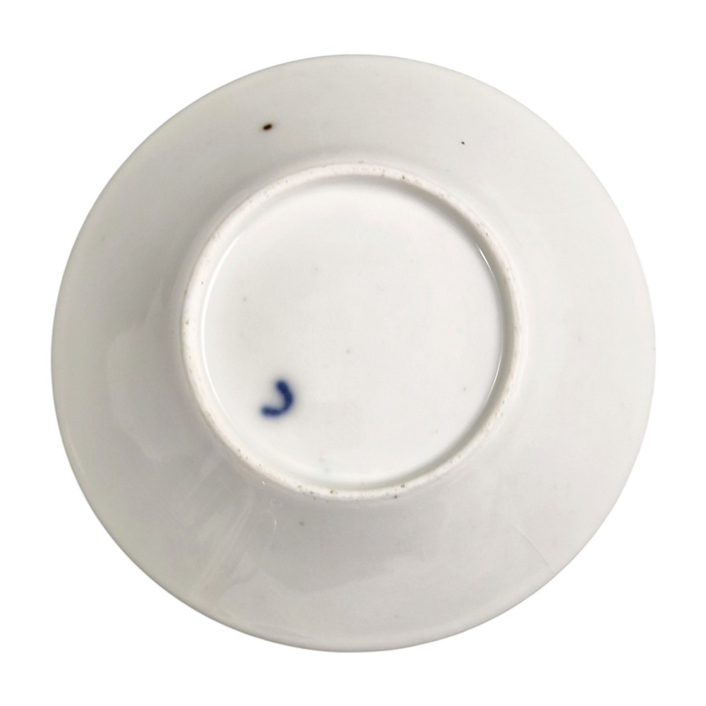 A French Old Paris porcelain cup and saucer featuring gilded trim, interior gold wash, and hand-painted panels depicting rural figures. View III