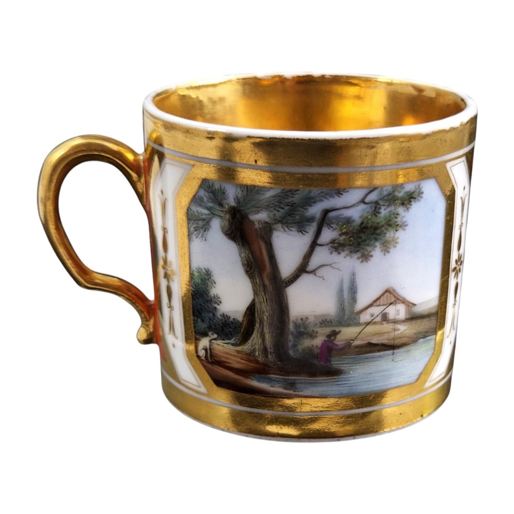 A French Old Paris porcelain cup and saucer featuring gilded trim, interior gold wash, and hand-painted panels depicting rural figures. View VI