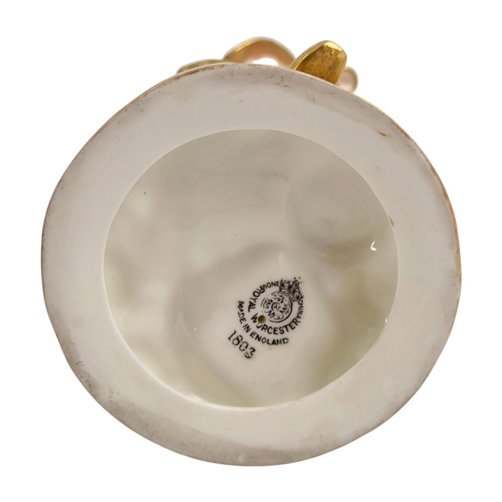 A pair of mid-century Royal Worcester bone china figurines depicting Strephon playing a pipe instrument and Phyllis playing a tambourine, finished in metallic gold and off-white porcelain. View VI