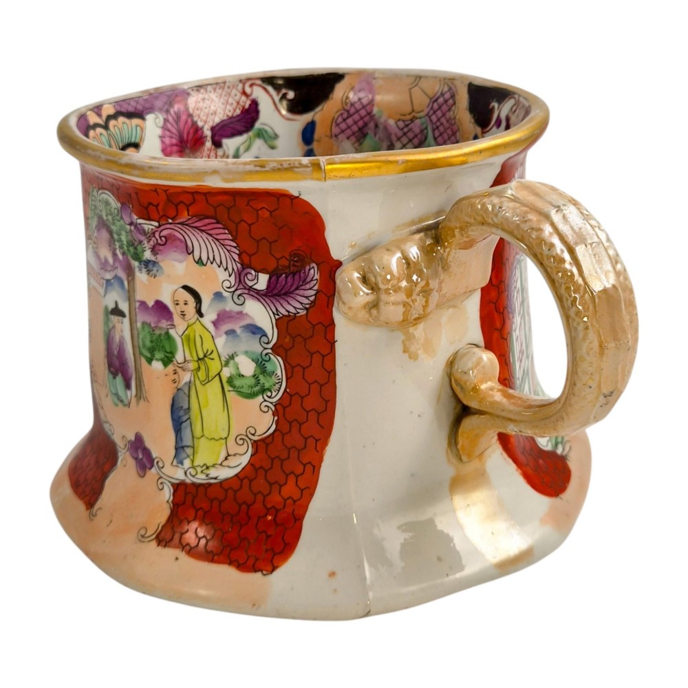 An antique Masons ironstone cider mug featuring a red scale background, hand-painted Chinoiserie panels, a flared base, and a sculpted hydra handle. View II